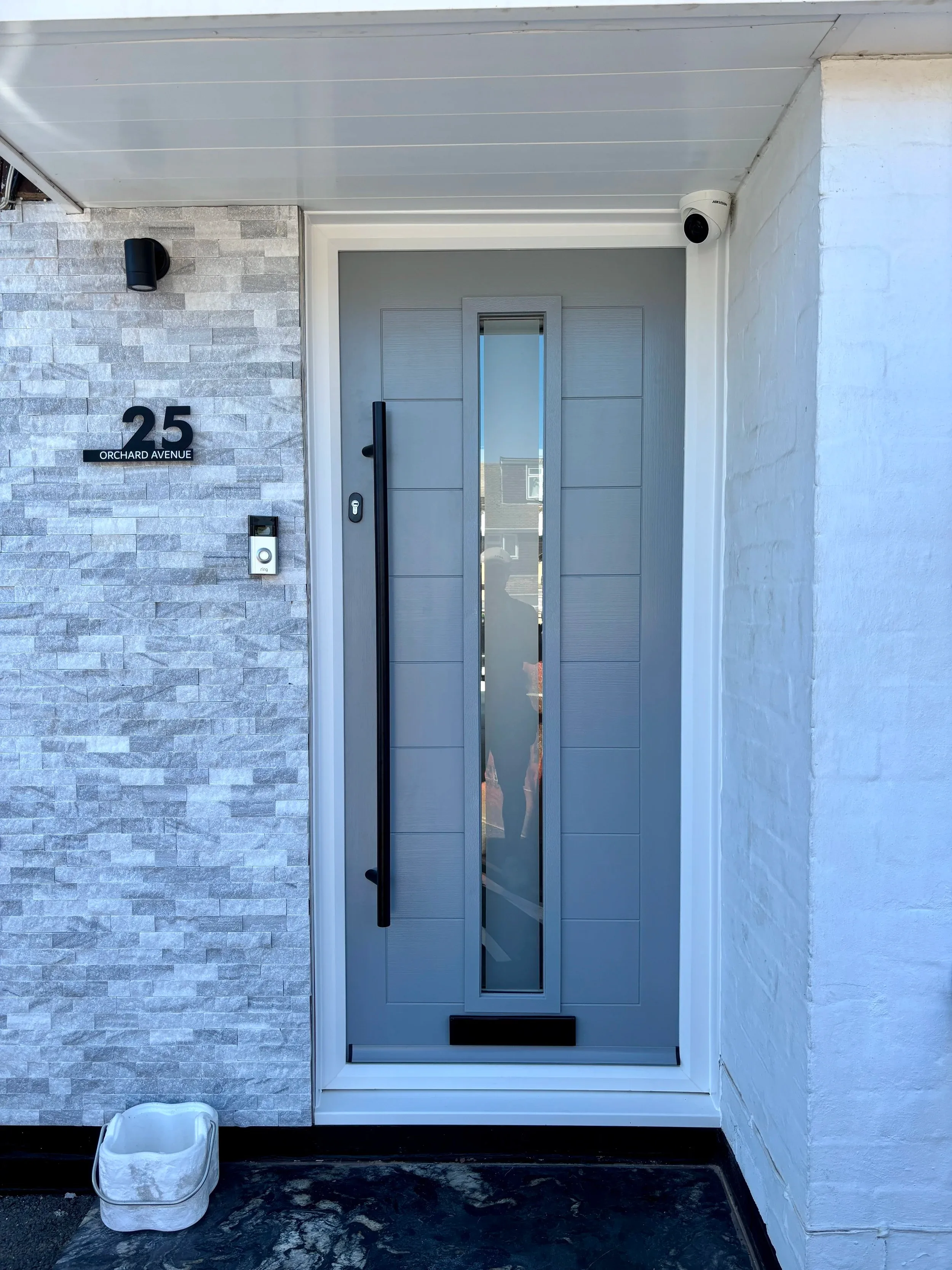 grey front composite door with black handle
