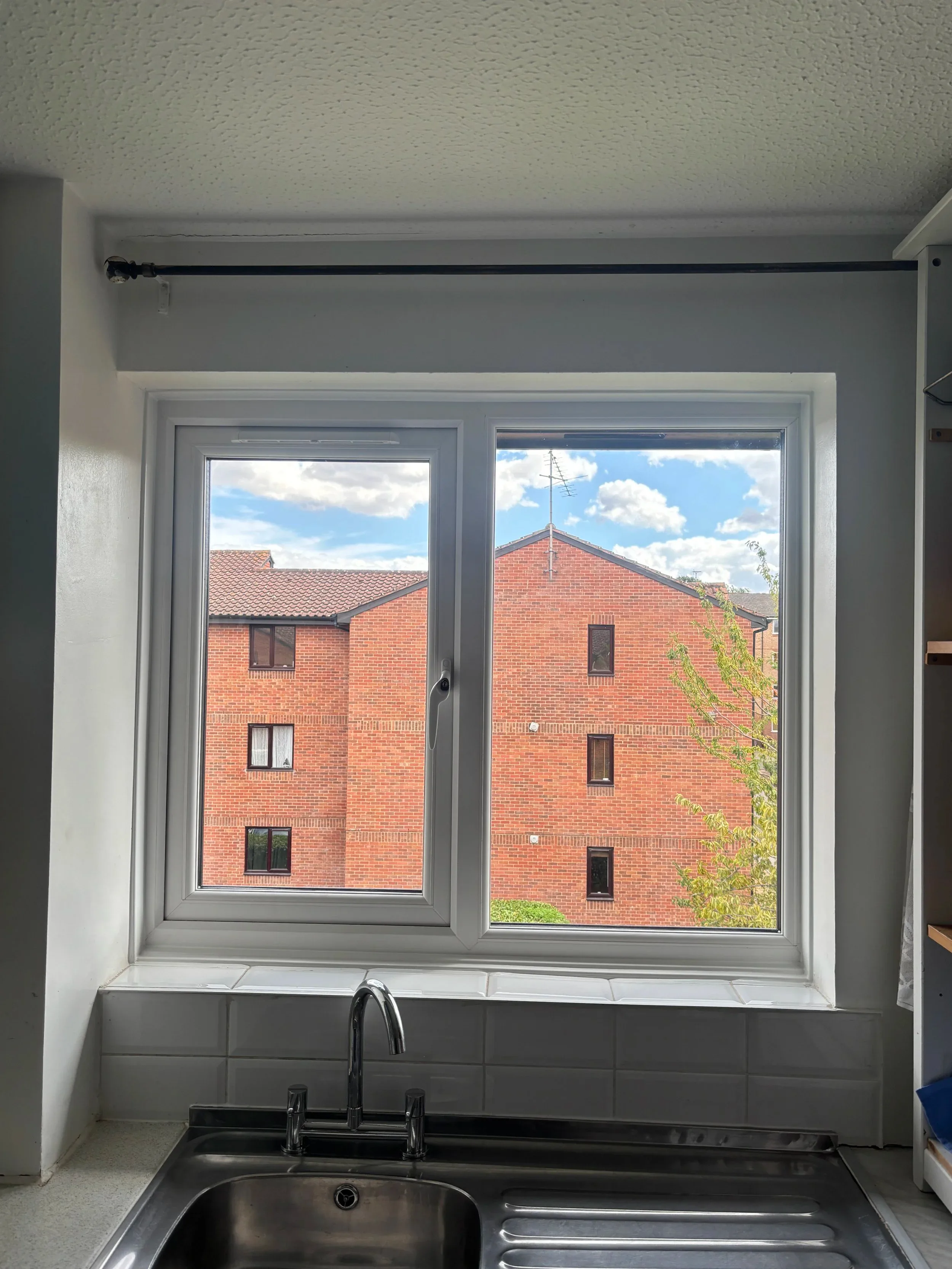 White double glazed casement window fitted above a kitchen sink