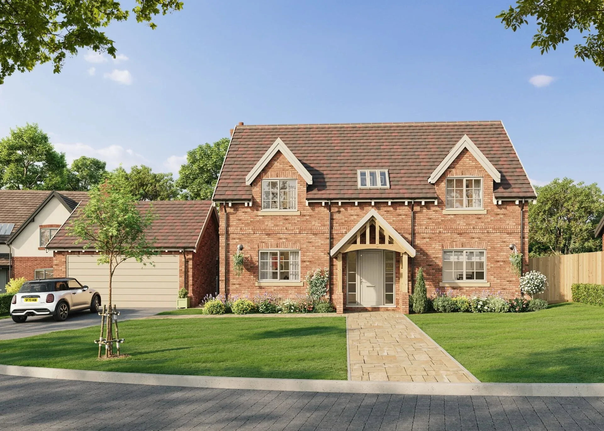 Detached new-build red brick house with a timber porch, white windows and a landscaped front garden