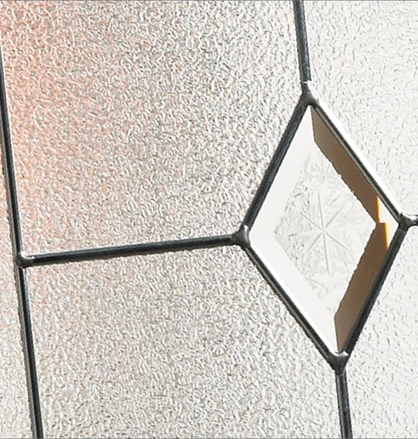 Classic composite door glass, a single bevelled diamond in dark leading on textured glass