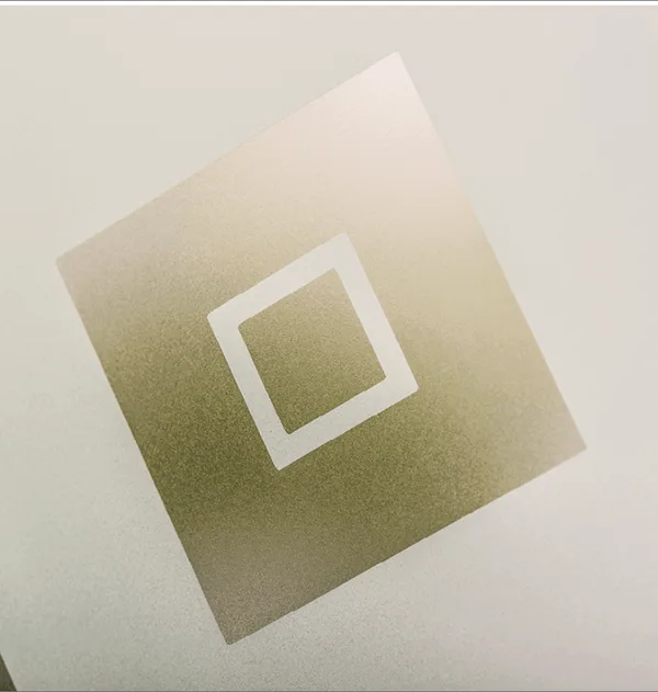 Greenwich composite door glass, a gold-tinted square with a clear square outline on frosted glass