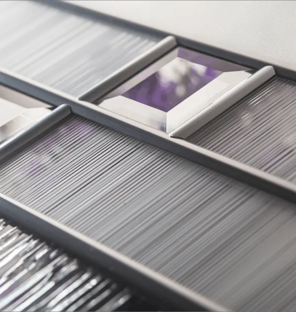 Horizon composite door glass, bevelled panes, one tinted purple, in dark leading over reeded glass