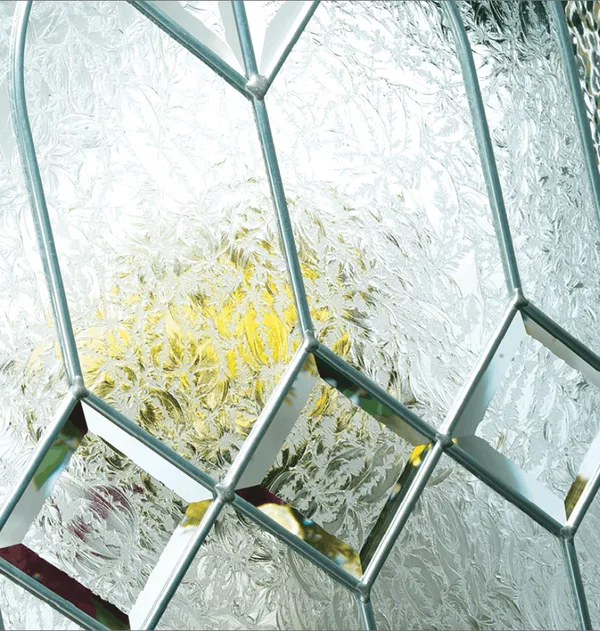 Simplicity composite door glass, clear bevels and a yellow-tinted pane in silver leading on textured glass