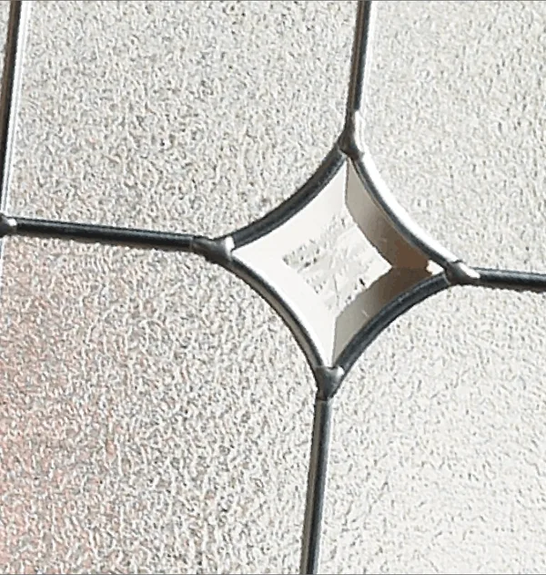 Zinc Art Star composite door glass, a four-pointed bevelled star in zinc leading on textured glass